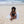 Femme allongée sur une fouta de plage couleur gris calcé - BY FOUTAS