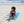 Femme allongée sur une fouta de plage couleur turquoise - BY FOUTAS