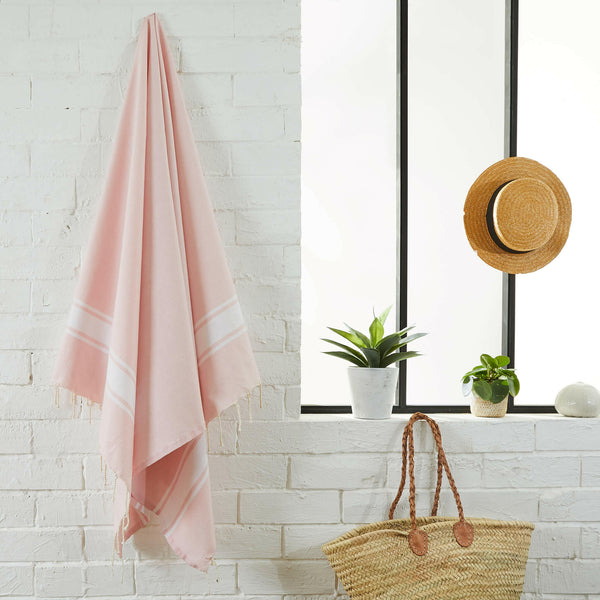 fouta flat weave baby pink color hanging in a bathroom - BY FOUTAS