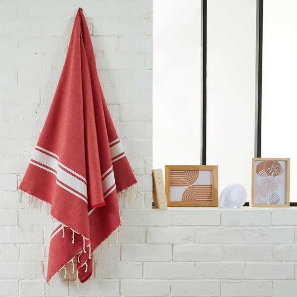 fouta flat weave red color hanging in a bathroom - BY FOUTAS