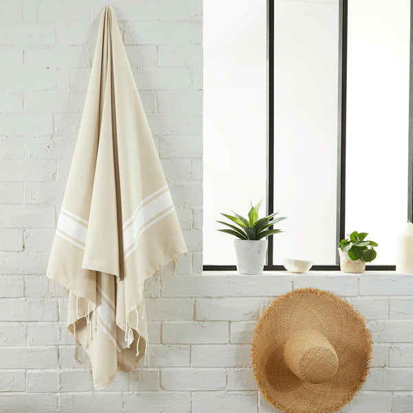 fouta flat weave color sahara hanging in a bathroom - BY FOUTAS
