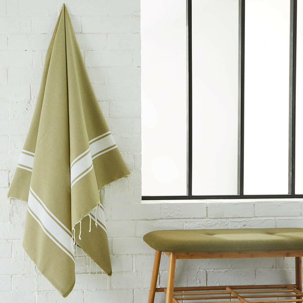fouta flat weave lime color hanging in a bathroom - BY FOUTAS