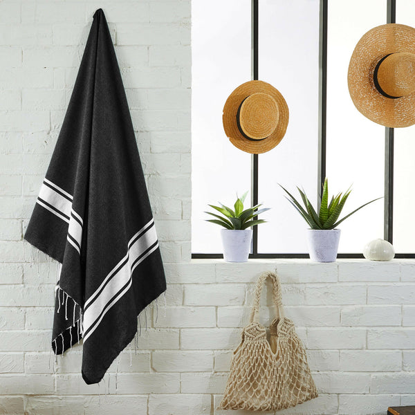fouta flat weave color black hanging in a bathroom - BY FOUTAS