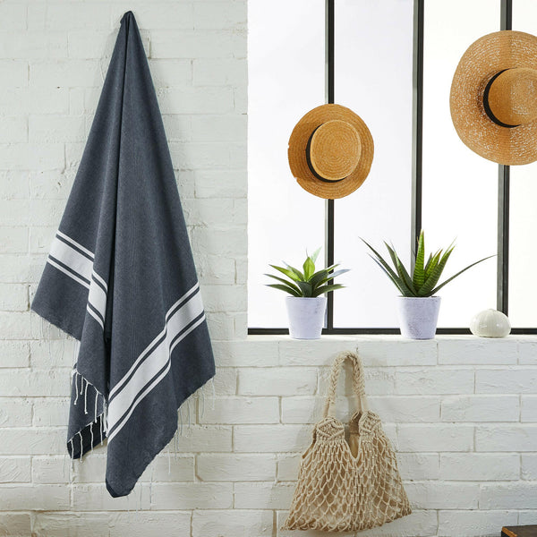 fouta flat weave navy blue color hanging in a bathroom - BY FOUTAS