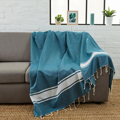Woman using a Teal XXL Fouta - BY FOUTAS