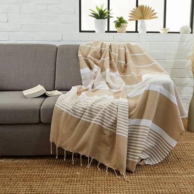 Woman using an XXL Sahara Fouta - BY FOUTAS