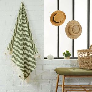 fouta mariniere khaki color hanging in a bathroom - BY FOUTAS