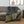 Bild in die Galerie laden, Saunatuch XXL Lurex anthrazitfarben - goldfarben gestreift als Sofaüberwurf verwendet -. BY FOUTAS
