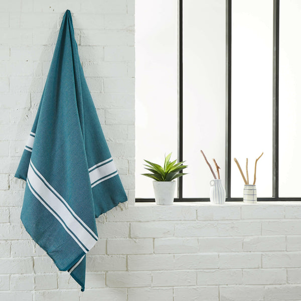fouta flat weave color blue duck hanging in a bathroom - BY FOUTAS