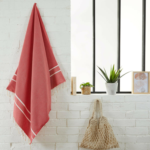 fouta Chevron poppy color hanging in a bathroom - BY FOUTAS