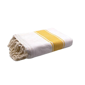 fouta mustard yellow terry cloth folded as a bath towel - BY FOUTAS