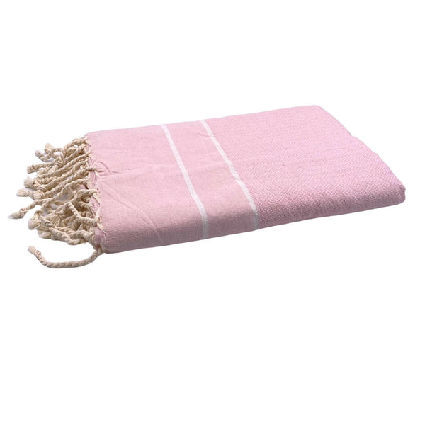 fouta Chevron couleur rose bébé pliée façon serviette de plage - BY FOUTAS