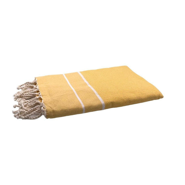 fouta Chevron couleur jaune moutarde pliée façon serviette de plage - BY FOUTAS