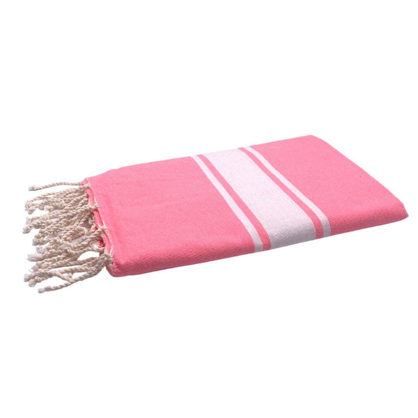fouta Tissage plat couleur rose fluo pliée façon serviette de plage - BY FOUTAS