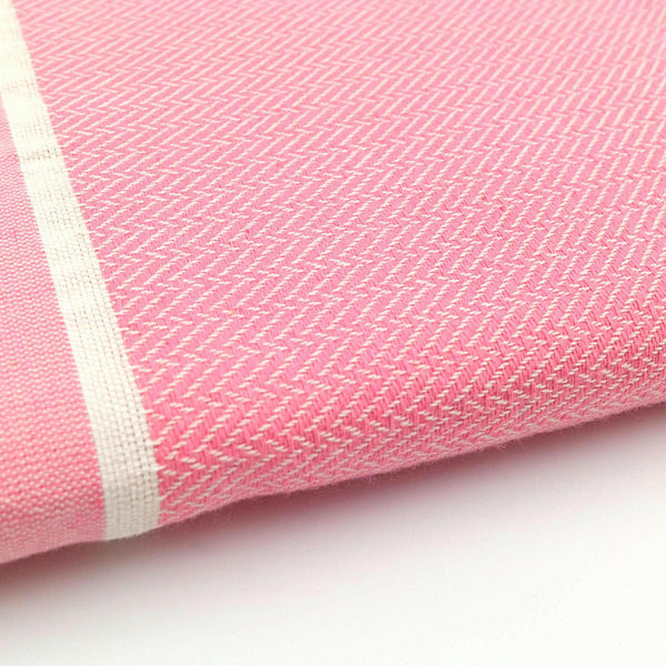 zoom on the beach fouta Chevron baby pink color - BY FOUTAS