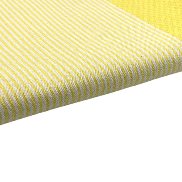zoom on the beach fouta Honeycomb color lemon yellow - BY FOUTAS