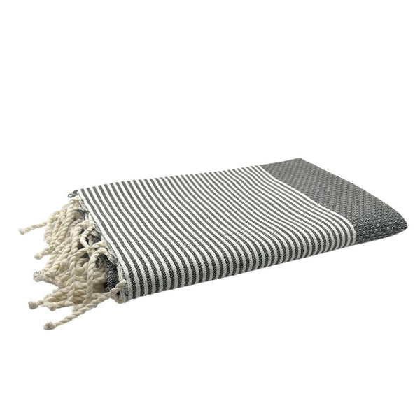 fouta Honeycomb color concrete gray folded as a beach towel - BY FOUTAS