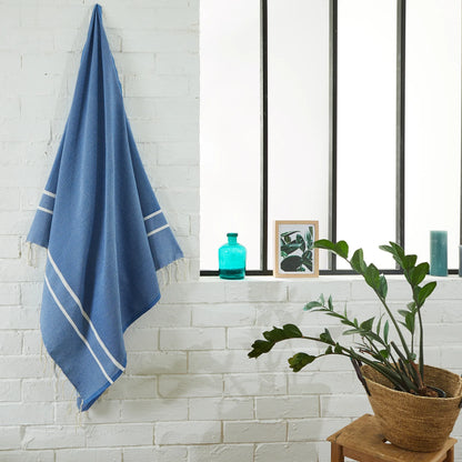 Woman using an Ocean Blue Chevron Fouta - BY FOUTAS