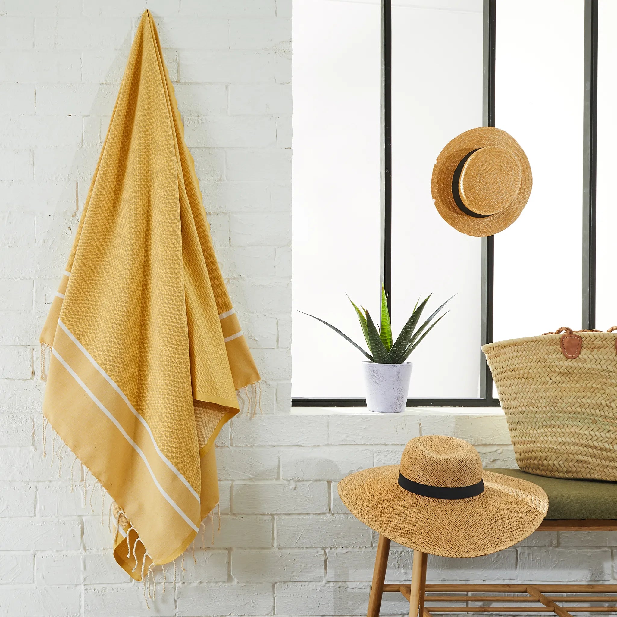 Woman using a Yellow Mustard Chevron Fouta - BY FOUTAS