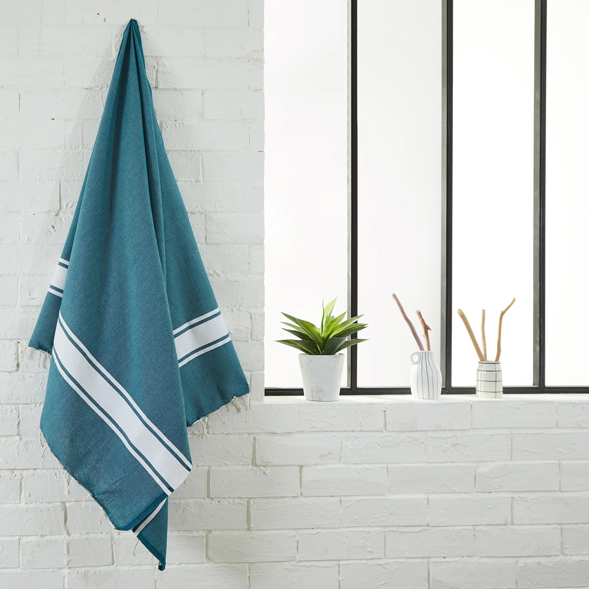 Woman using a Customizable Classic Duck Blue Fouta - BY FOUTAS