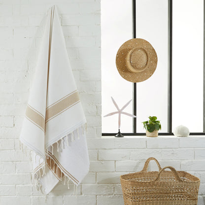 Woman using a White/Sahara Sponge Fouta - BY FOUTAS