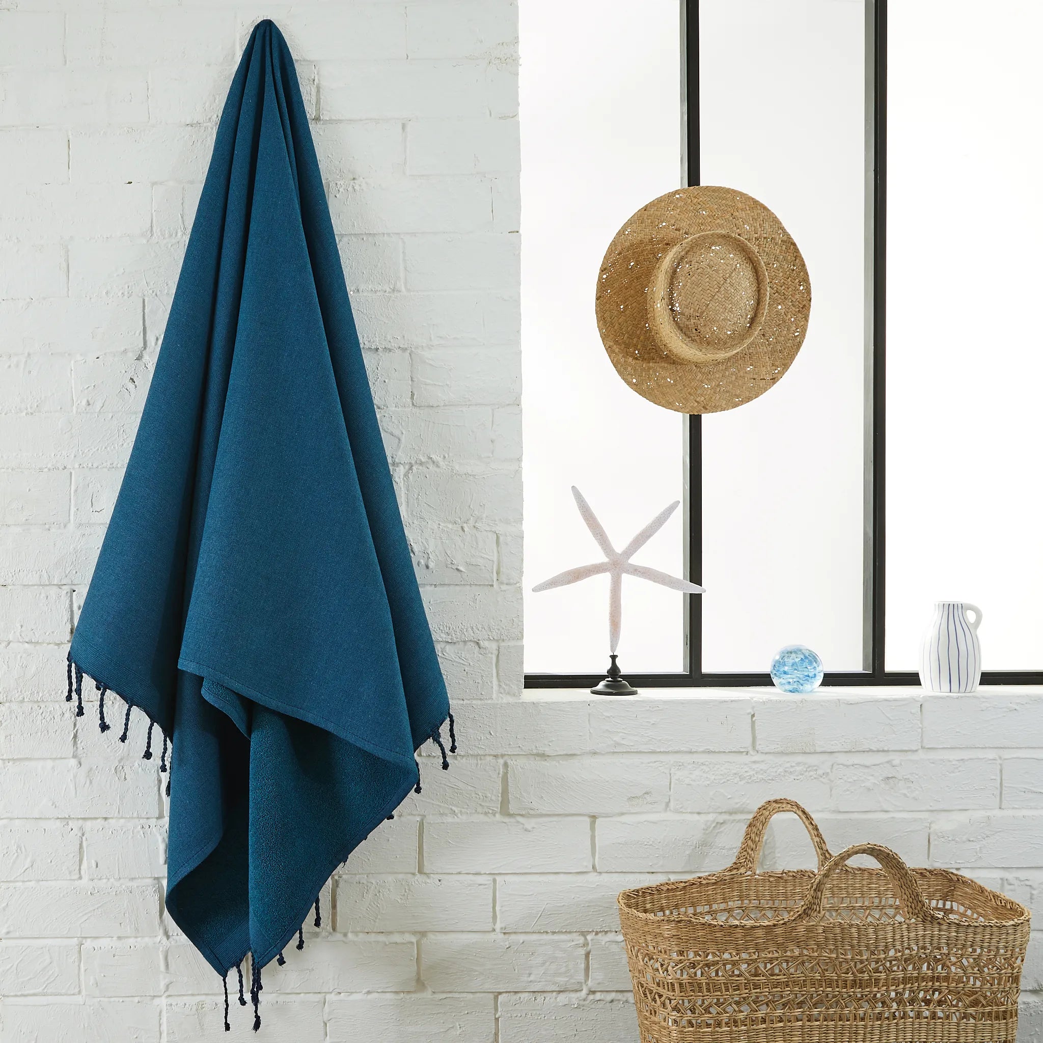 Woman using a Duck Blue Terry Fouta - BY FOUTAS